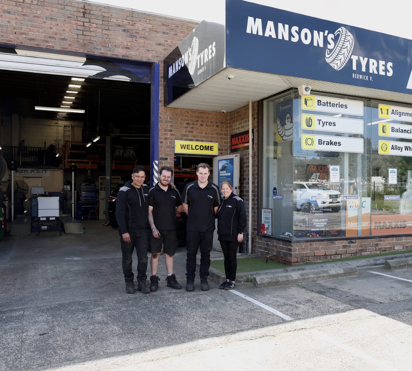 The Manson's Tyres team outside the shop in Enterprise Avenue, Berwick