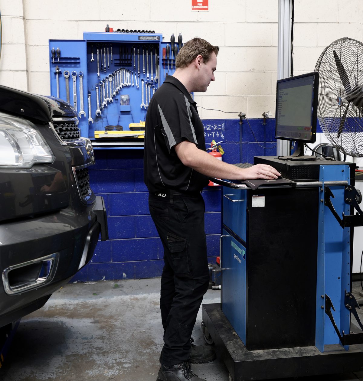 Joel at the alignment screen at Manson's Tyres
