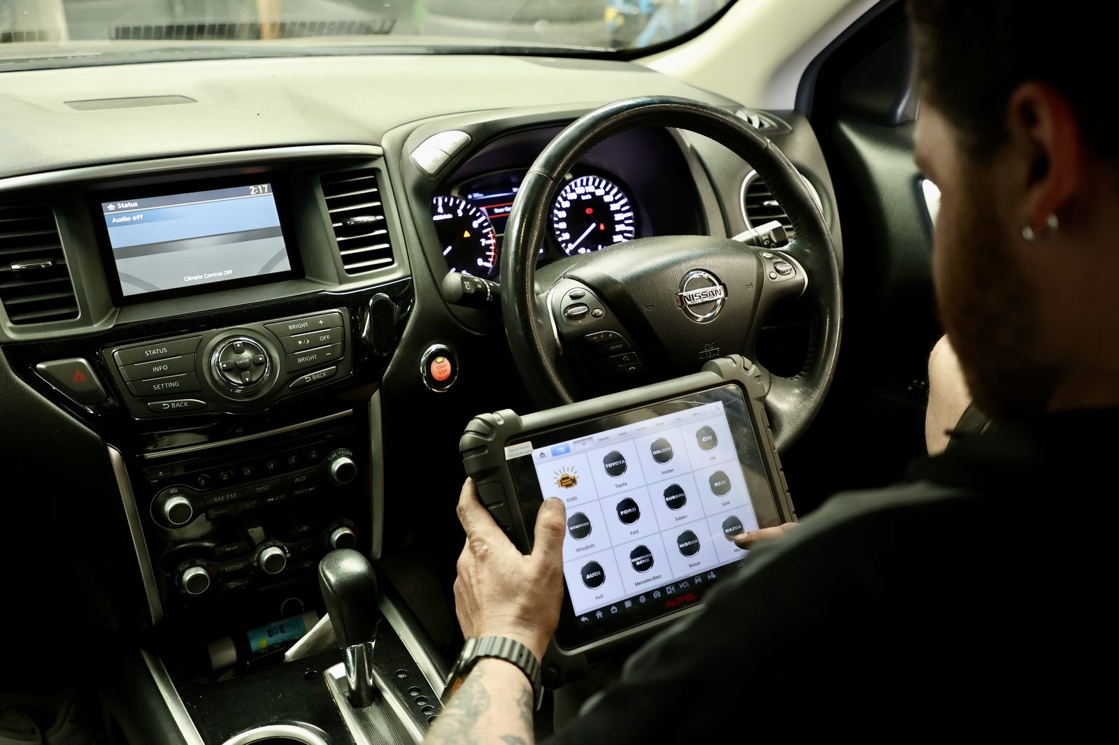 A scan tool plugged in and read from the driver's seat