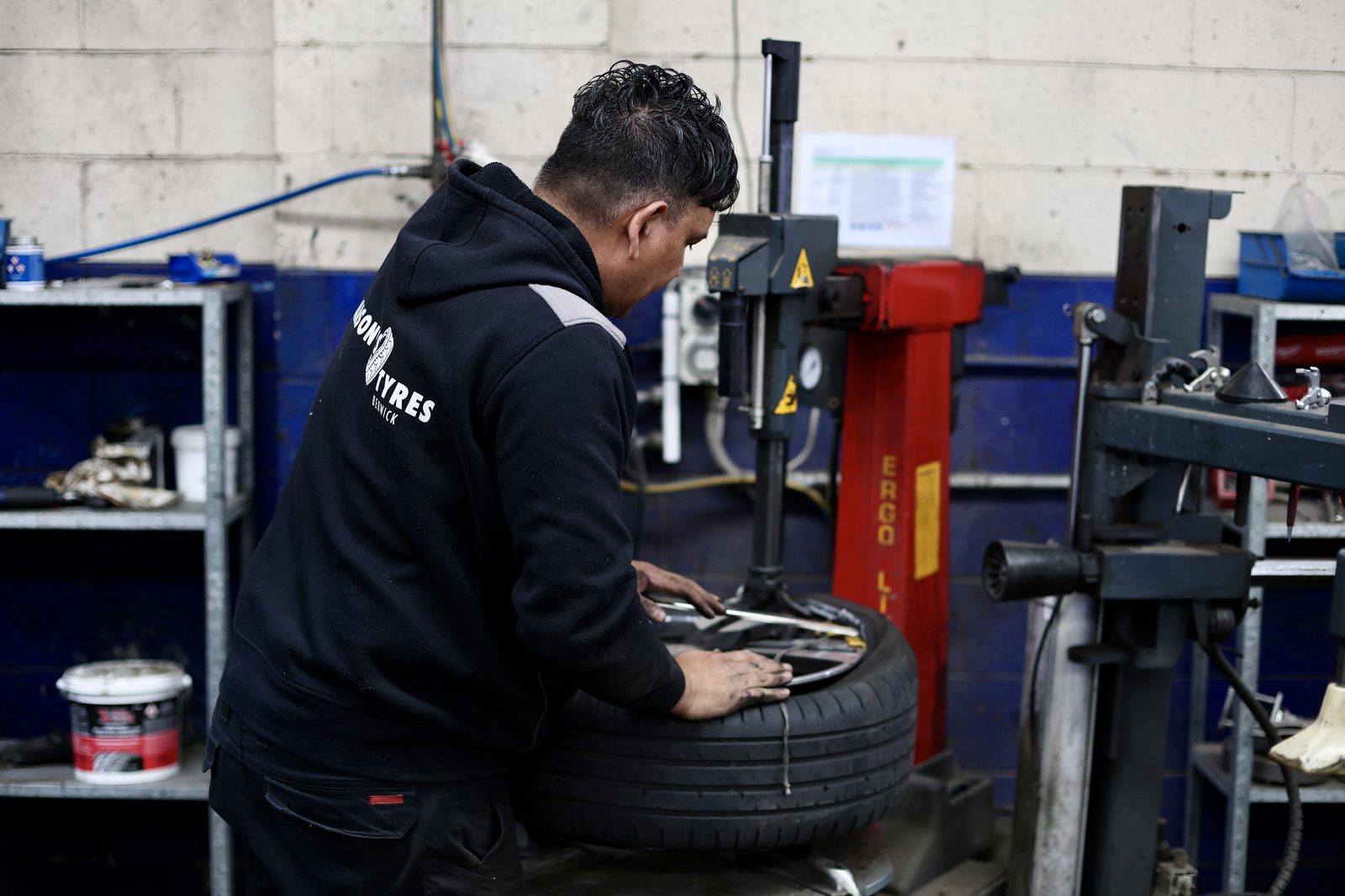 A tyre going onto the machine in the Berwick workshop